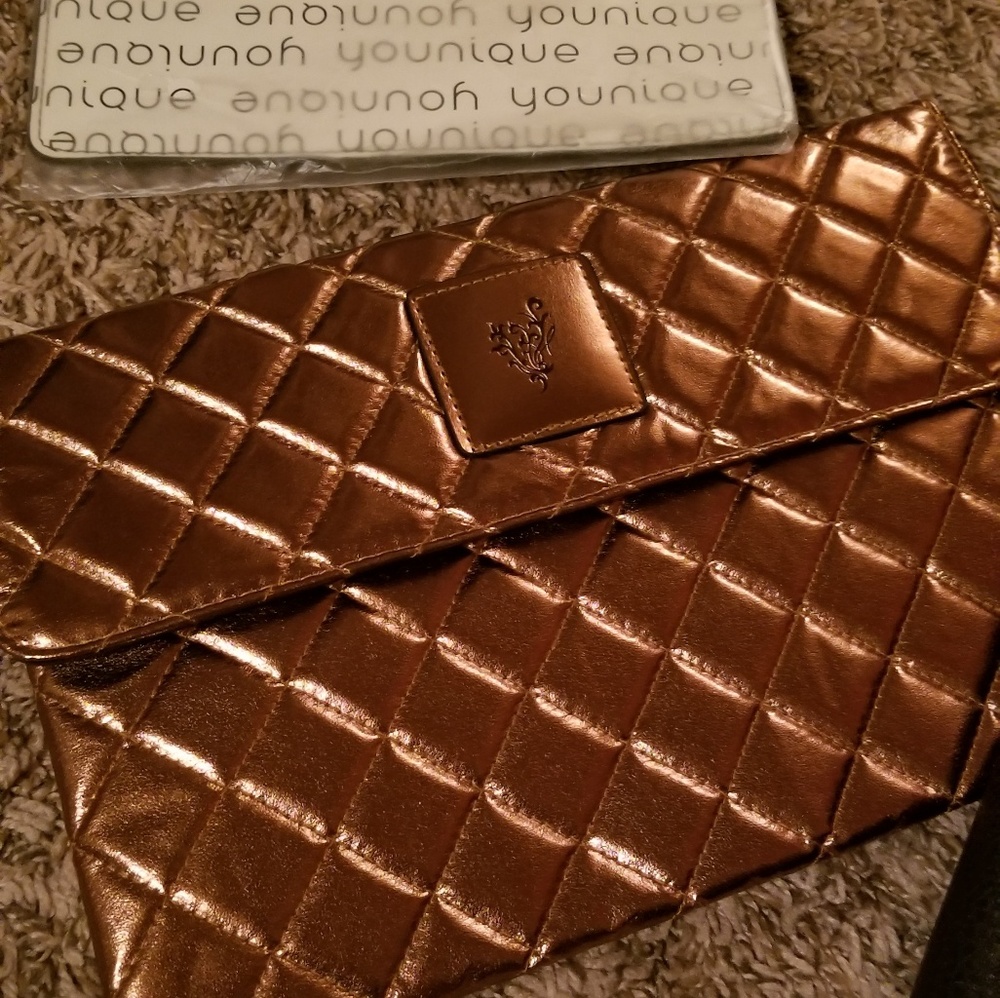 Younique gold hand bag